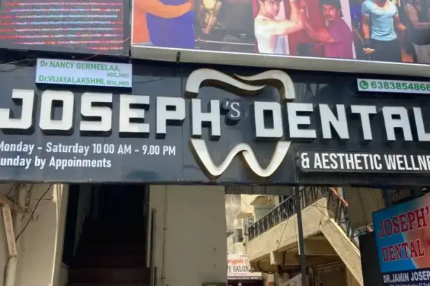 Joseph’s Dental & Aesthetic Wellness clinic signboard with contact number and working hours displayed outside the dental clinic.